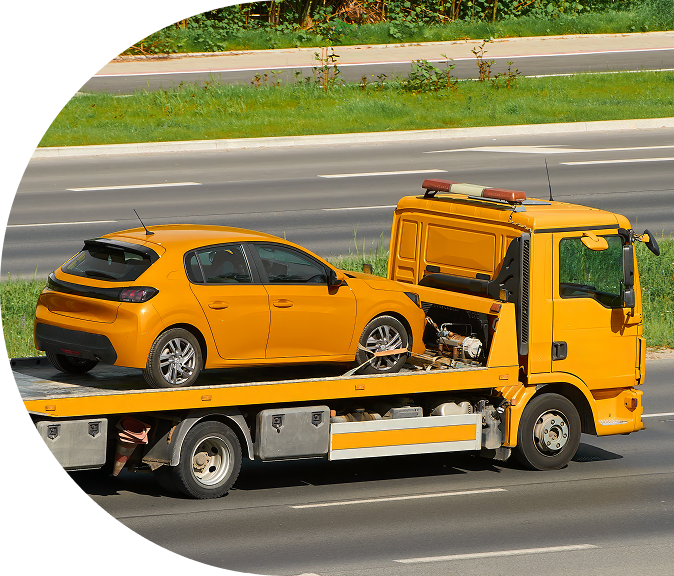 Tow truck loading a yellow car